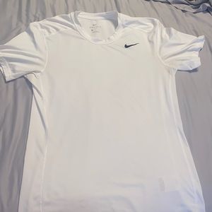 Men’s small white Nike dri fit tee shirt.